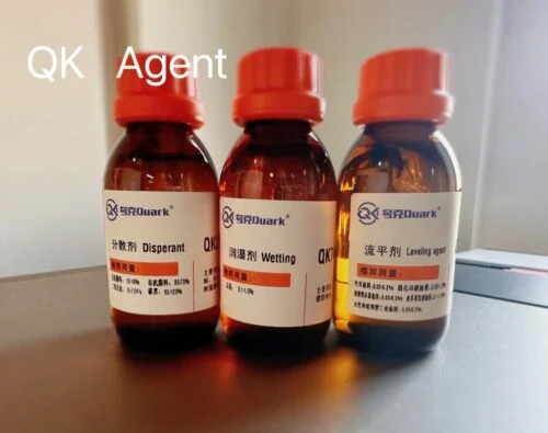 Three amber sample bottles of QK dispersant, wetting agent and levelling agent