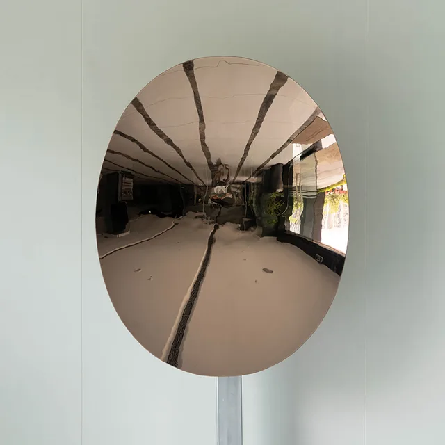 Blue stainless steel elliptical concave mirror wall Sculpture seen from another angle