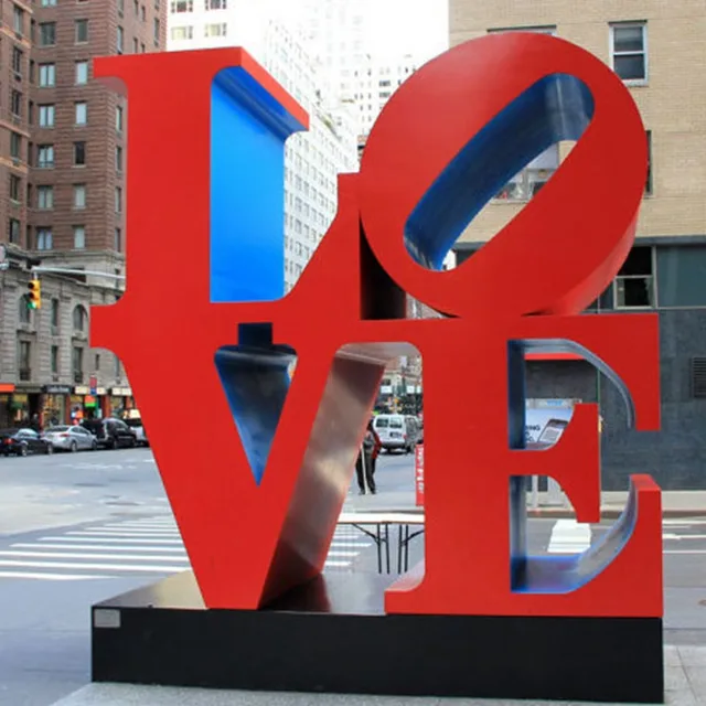 Personalized handmade shining red english alphabet sculpture in close view