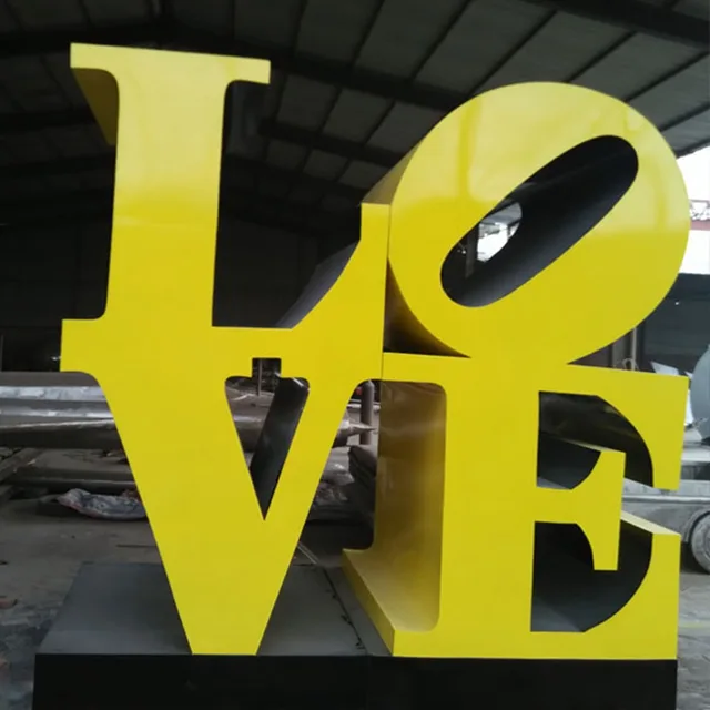 Personalized handmade shining red english alphabet sculpture detail of the surface