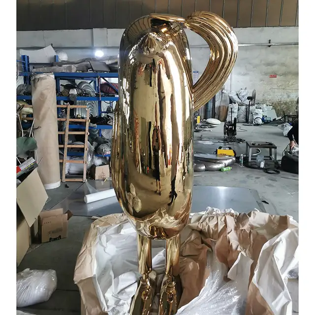 Deluxe indoor golden stainless steel bird sculpture seen from another angle