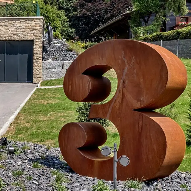 Figure Garden Metal Outdoor Corten Steel Sculpture shown in its setting
