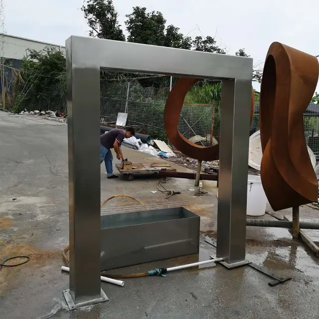 Modern metal sculpture outdoor pool stainless steel fountain door frame sculpture in close view