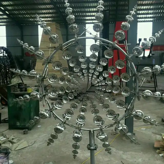 Hot Sale Modern Outdoor Garden 2 M Diameter Metal Stainless Steel Wind Kinetic Sculpture shown in its setting