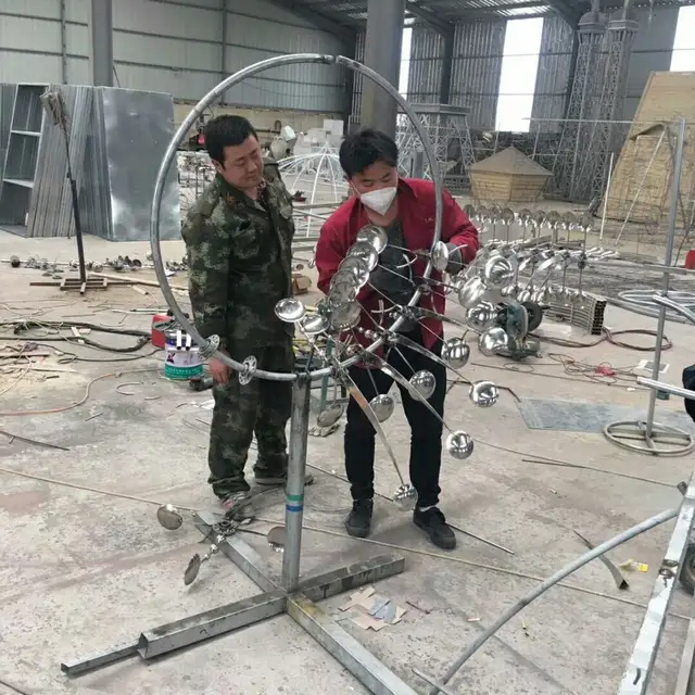 Outdoor Stainless Steel Rainbow Kinetic Wind Spinner Sculpture from the side