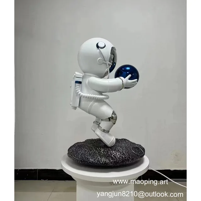 Indoor halls museums schools airports art galleries decorations stainless steel astronaut sculptures seen from another a