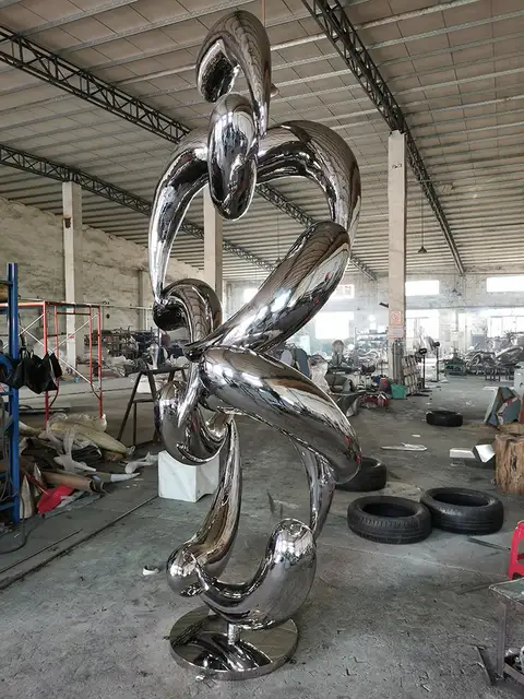 Large outdoor abstract stainless steel fish school sculpture