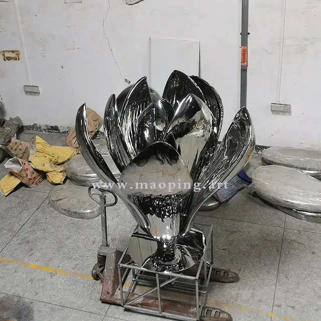 Large outdoor garden courtyard polished stainless steel flower sculpture in close view