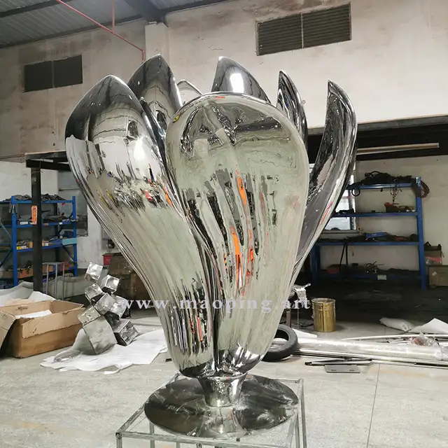 Large outdoor garden courtyard polished stainless steel flower sculpture seen from another angle