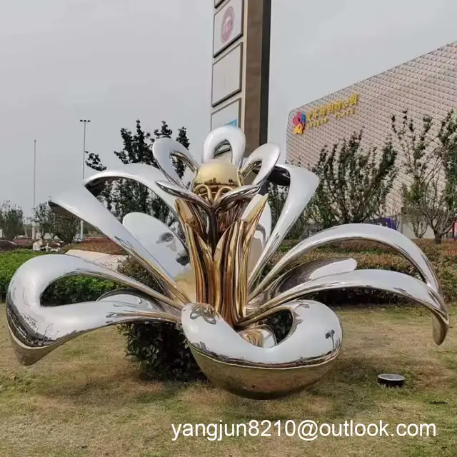 Large outdoor park square courtyard beach shopping center stainless steel abstract flower sculpture seen from another an