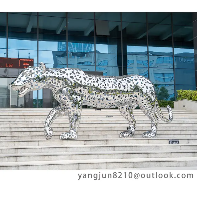 Large outdoor plaza museum airport mirror polished stainless steel leopard sculpture seen from another angle