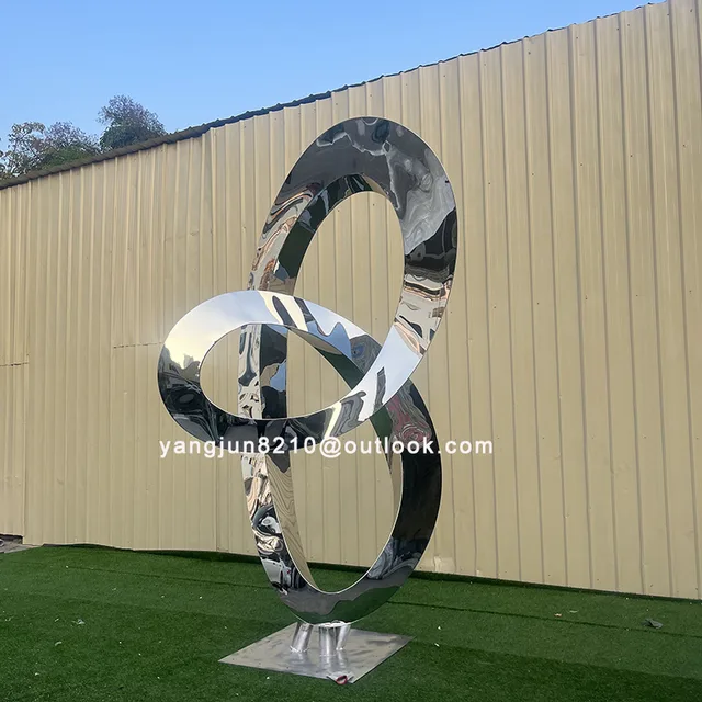 Large outdoor square beach Metal Art stainless steel Abstract Ring sculpture seen from another angle