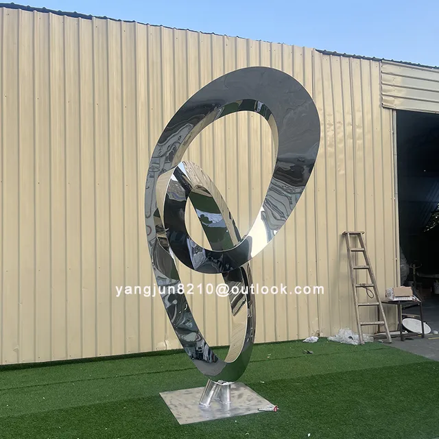 Large outdoor square beach Metal Art stainless steel Abstract Ring sculpture in close view