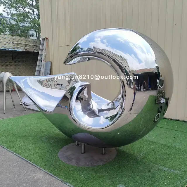 Large outdoor square beach Metal Art stainless steel Abstract waves sculpture seen from another angle