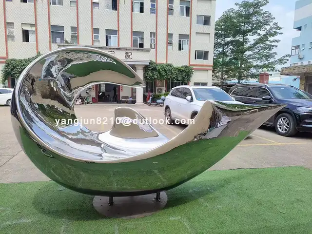 Large outdoor square beach Metal Art stainless steel Abstract waves sculpture in close view