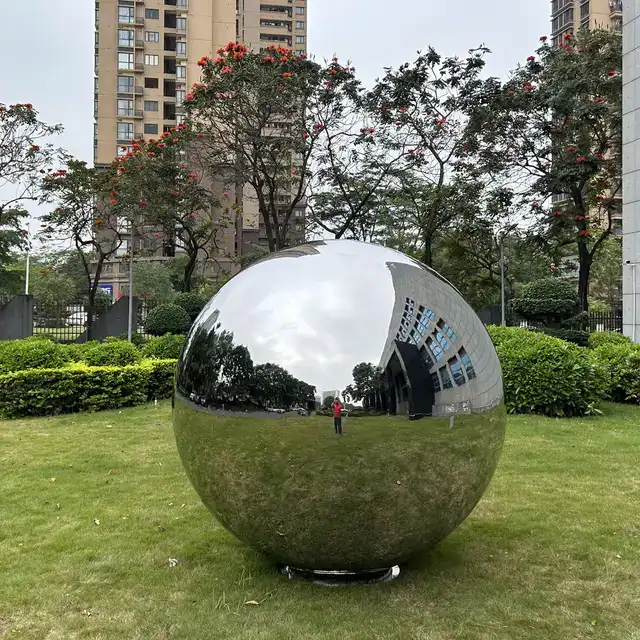 Large Outdoor square garden courtyard Mirror polishing stainless steel sphere sculpture seen from another angle