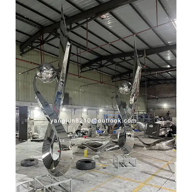 Large outdoor square park courtyard pool decoration art Mark abstract stainless steel sculpture in close view