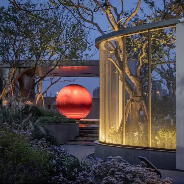 Large-scale metal ball outdoor square community stainless steel red sphere sculpture seen from another angle