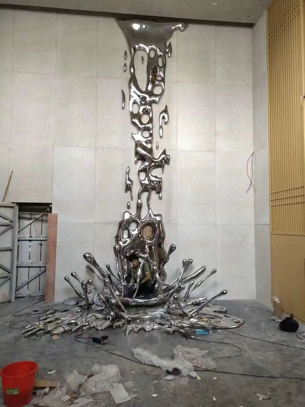 Large stainless steel spray sculpture