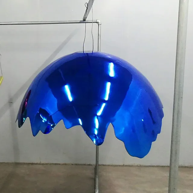 Metal Modern Art blue Stainless Steel Egg Sculpture shown in its setting