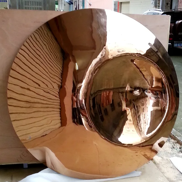 Large stainless steel sculpture—Mirror concave sculpture in close view