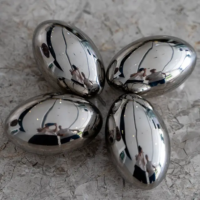 Mirror polished Stainless Steel Ellipsoids shown in its setting