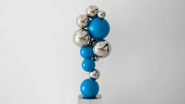 Modern outdoor abstract color stainless steel sphere sculpture from the side