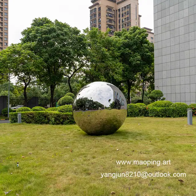 Outdoor airport park square school library cinema museum mirror polished stainless steel Lunar sculpture seen from anoth
