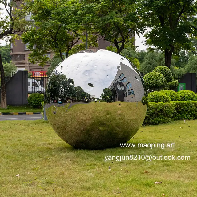 Outdoor airport park square school library cinema museum mirror polished stainless steel Lunar sculpture in close view