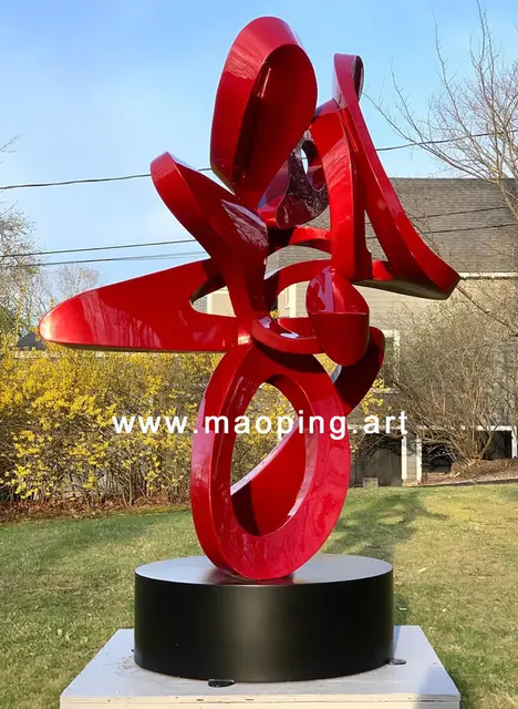Outdoor garden courtyard Abstract red stainless steel sculpture seen from another angle