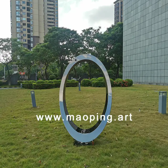 Outdoor garden courtyard Electroplating black titanium Stainless steel ring sculpture shown in its setting