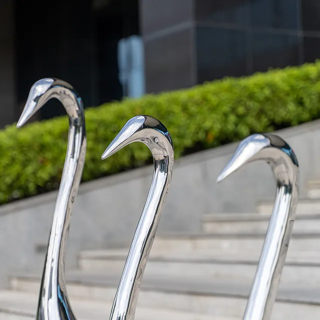 Outdoor garden grass courtyard home decoration stainless steel swan sculpture shown in its setting