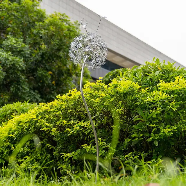 Outdoor garden grass Stainless steel dandelion sculpture shown in its setting