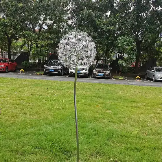 Outdoor garden grass Stainless steel dandelion sculpture seen from another angle