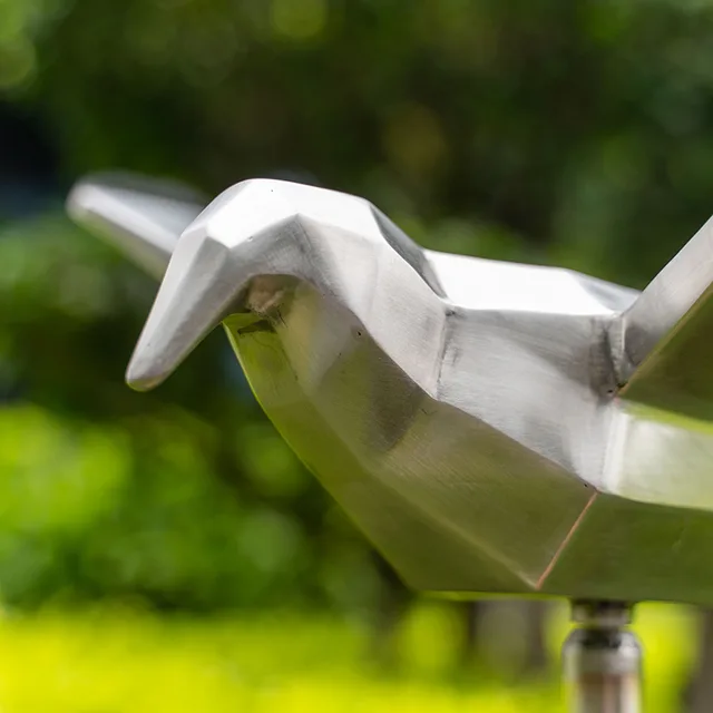 Outdoor garden grass Stainless steel seagull sculpture seen from another angle