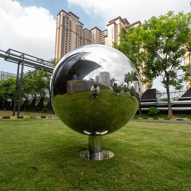Outdoor garden metal sculpture mirror polished stainless steel sphere sculpture seen from another angle