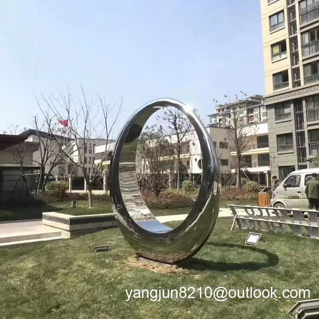 Outdoor square beach landscape sculpture design stainless steel ring sculpture from the side