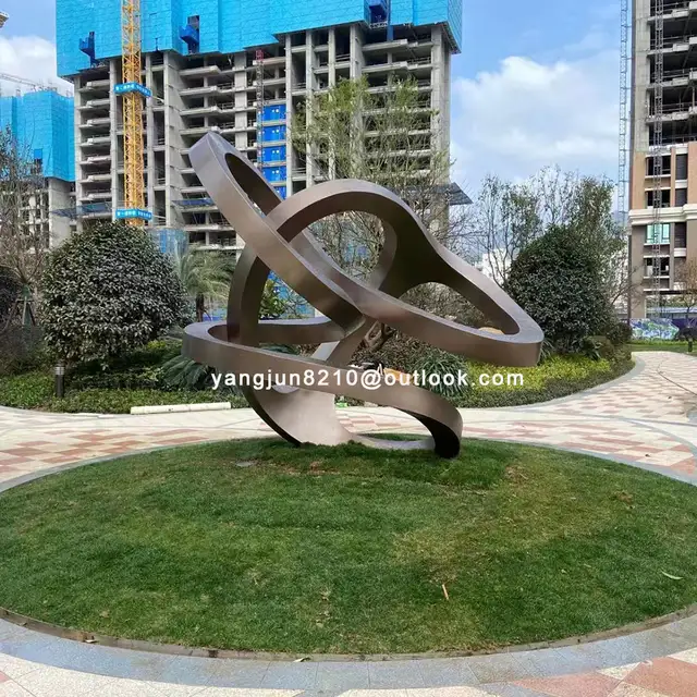 Outdoor square garden courtyard Abstract stainless steel Ring sculpture seen from another angle