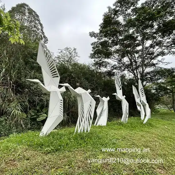 Outdoor square park grass white fluorocarbon paint stainless steel goose sculpture seen from another angle