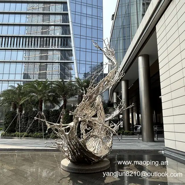 Outdoor square park lawn waterscape swimming pool stainless steel spray sculpture seen from another angle