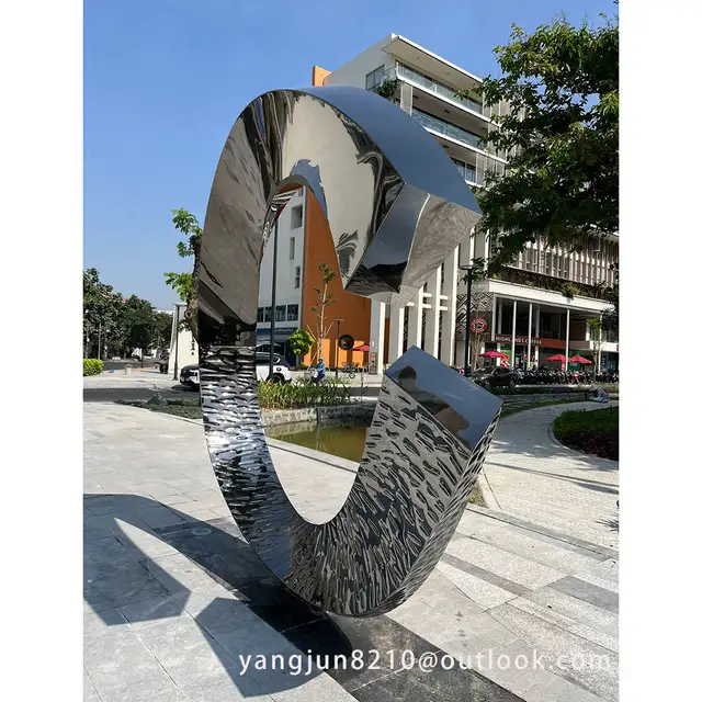 Outdoor square park library school airport theater art stainless steel “C”sculpture from the side