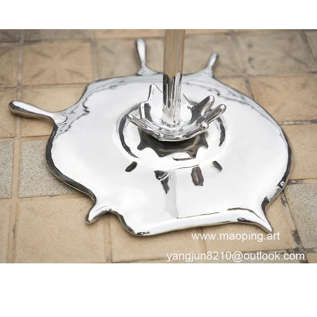 Outdoor square park museum airport beach swimming pool stainless steel paint bucket sculpture in close view