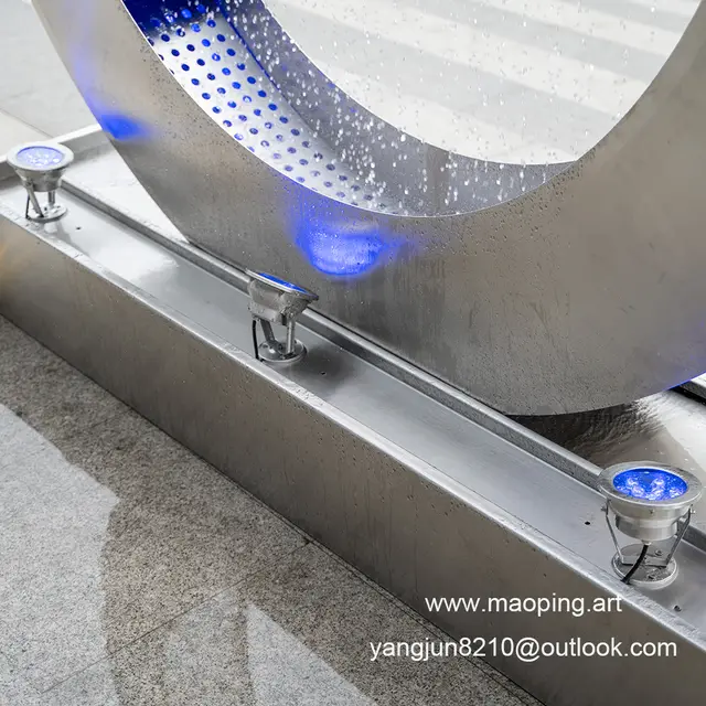 Outdoor square park museum airport beach swimming pool stainless steel ring water curtain sculpture in close view