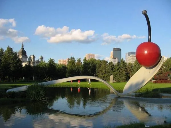 Red cherry sculpture with white spoon colorful