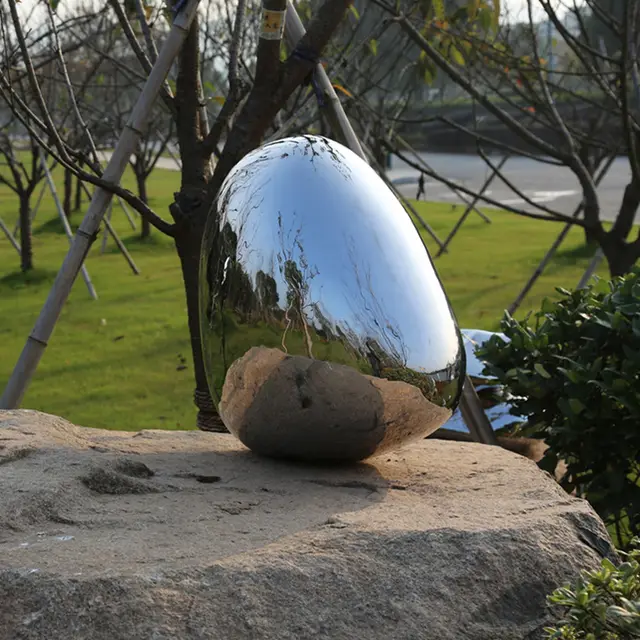 Large stainless steel sculpture—Meteorite from the side