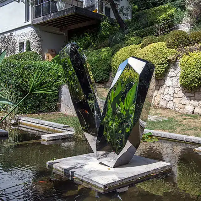 Large stainless steel sculpture—Crystal stone shown in its setting