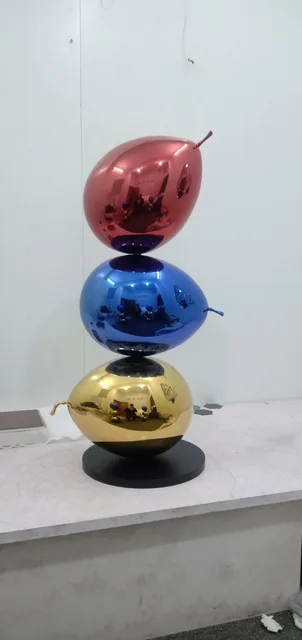 Large Outdoor Stainless Steel Painted Balloon Dog Sculpture shown in its setting