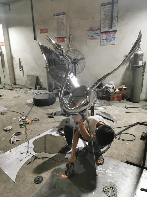 Stainless steel sphere Large stainless steel sculpture—Crane seen from another angle