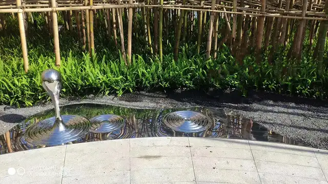 Stainless steel water pattern sculpture from the side