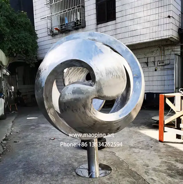 Swirling Painted Stainless Steel Sphere Sculpture in Toronto from the side